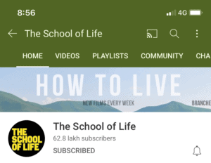 The School of Life banner art, with 'How To Live' displayed in white block letters.